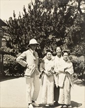 European man with two geisha and their 'okaa-san'