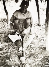 A Kikuyu metalsmith at work
