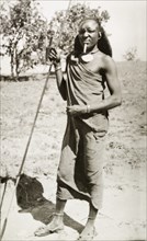 Kenyan man with traditional dress and spear