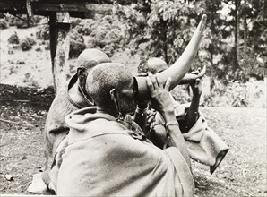 Kikuyu elders drinking beer