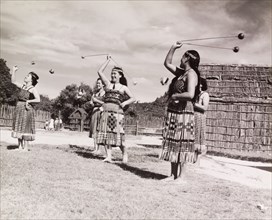 Maori women perform the 'double long poi'