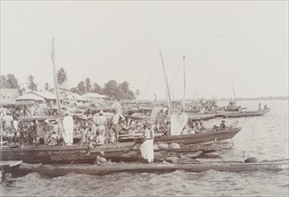 Boats with merchandise lining the shore at Badagry on market day