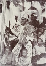 African leader [King?] surrounded by his retainers and family