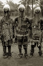 Four JuJu men in their costumes