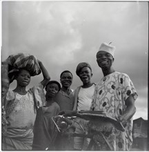 Ibadan: Town and market, group of men with bicycle
