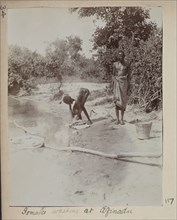 Somalis washing in river at Afinadu