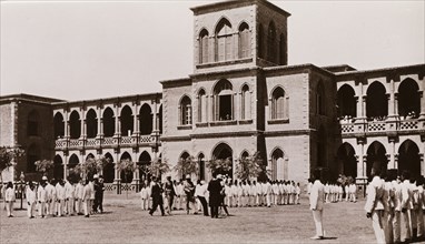 Lines of military figures outside the Gordon College, Khartoum