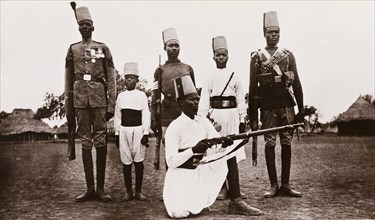 Six uniformed Sudanese soldiers armed with rifles