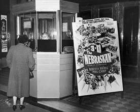 Woman Buying Movie Ticket