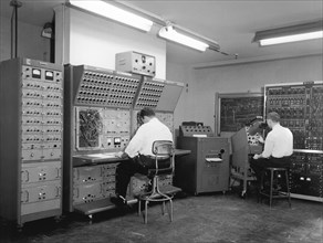 Men Working On Analog Computer