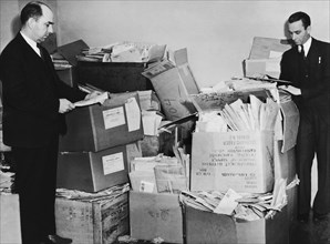 Men With Piles Of Mail