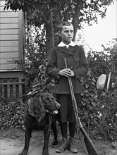Boy With His Rifle And Dog