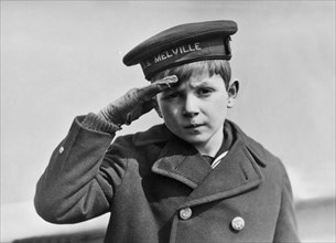 A Young Boy Saluting
