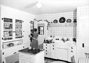 Woman Cooking In Her Kitchen