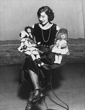 Woman With Dolls