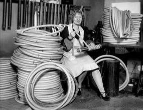 A Woman Making Bicycle Tires