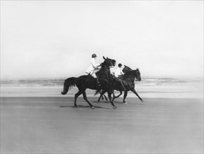 Riding Horses On The Beach