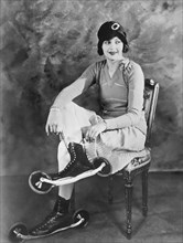 Woman With Her Bicycle Skates