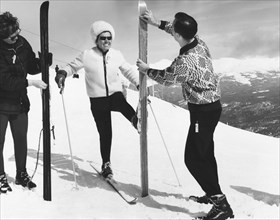 Women Waxing Skis