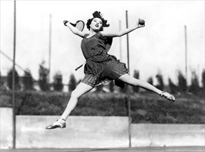 Leaping Tennis Woman