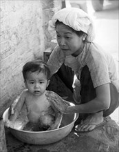 Vietnamese Orphan Bathing