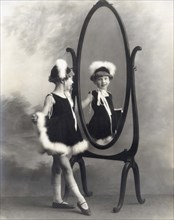 A Young Girl In A Mirror