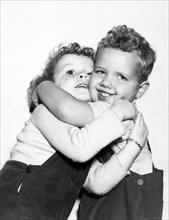Small Boy Hugging His Sister