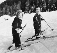 Two Children Skiing