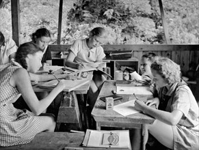 United States:  c. 1929.
An art class in a Girl Scout Sylvan Camp.