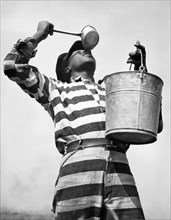 Prisoner Quenches His Thirst