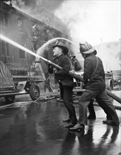 Firemen With Hose