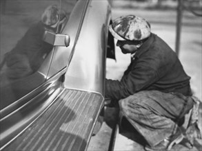 Mechanic Working On Car
