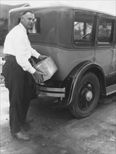 Man Filling Car With Fuel