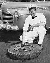 Man Fixing A Flat Tire