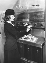 Stewardess Preparing Dinner
