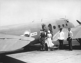 Passengers Boarding Airplane