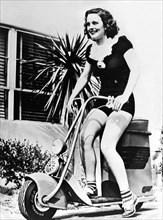Actress Riding A Scooter