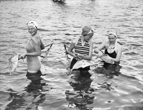 Women Gigging Fish In Miami