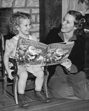 Child Reading A Christmas Book