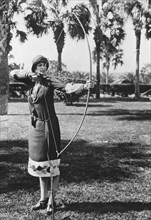 Woman Demonstrates A Longbow