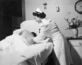 Nurse Gives Patient Rub Down