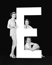 The Letter "E" And Three Women