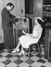 Woman Buying A Radio