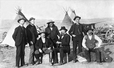Frontier Men At An Indian Camp