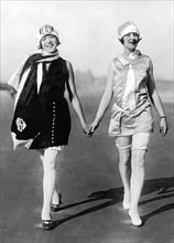 Two Women Walking On Beach