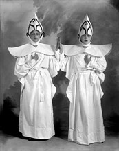 Two Women In Matching Costumes