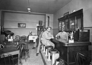 Men Sitting At A Bar