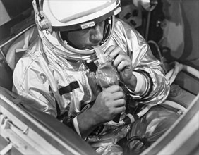 Houston, Texas:  March, 1966.
A NASA test subject consumes a meal of pot roast and gravy through a