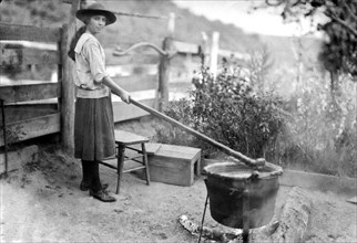 Little Orleans, Maryland:  October 28, 1920.
A young girl making apple butter the same way her
