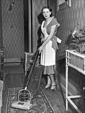 A Woman Vacuuming
